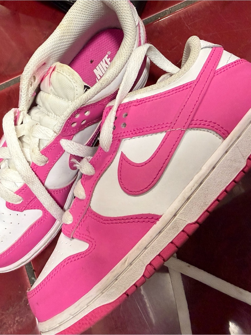 Nike Kids Pink and White Low-Top Sneakers — Bold Swoosh Design